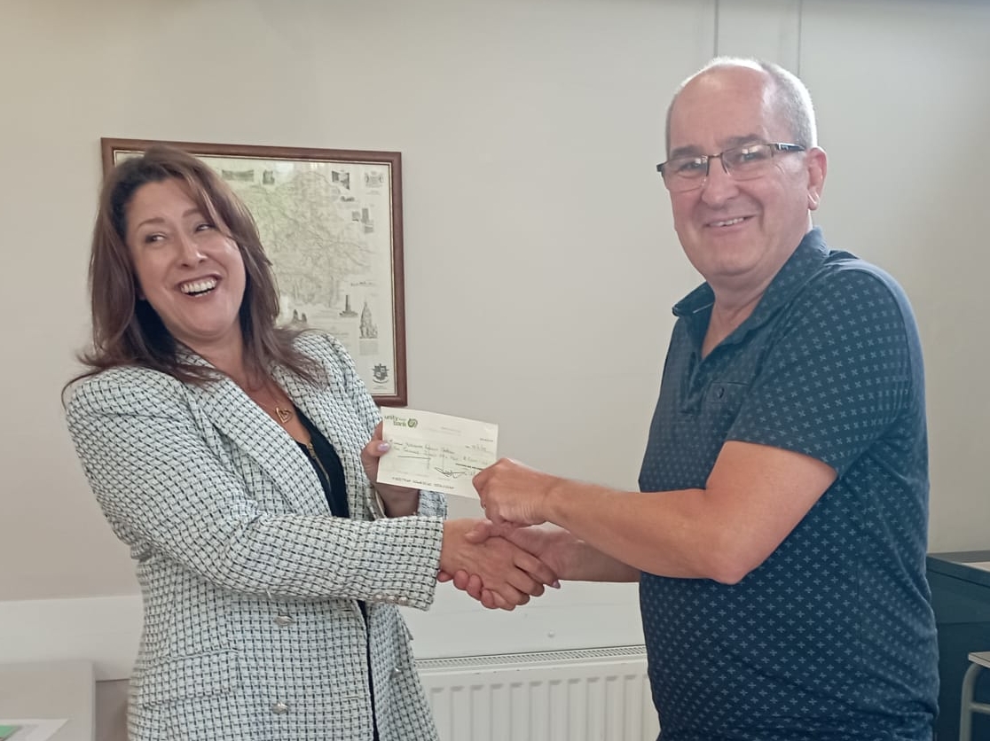 South Lakes Labour chair Paul Braithwaite presents Barrow & Furness parliamentary candidate Michelle Scrogham with a cheque for £5000 at the June all members